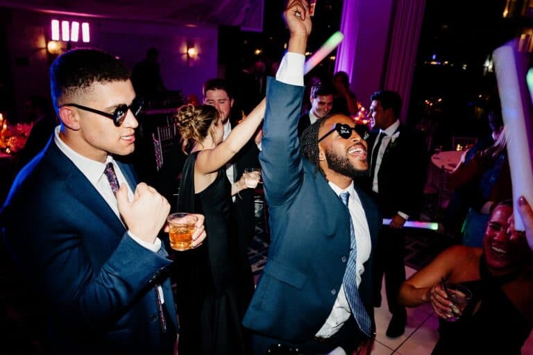 Party guests dancing and enjoying music at a Chicago DJ event.