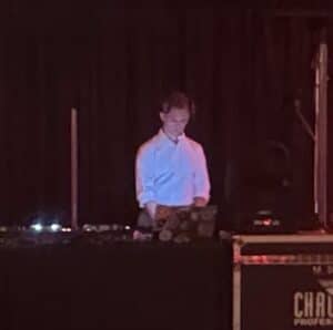 DJ performing at a Chicago event with professional equipment.
